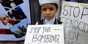 A Bangladeshi child protests against Israeli attack on Gaza in Dhaka, Bangladesh, Saturday, July 12, 2014. (AP Photo/A.M. Ahad)