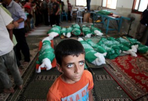 Funeral ceremony is held for Palestinian Abu Jamei family members, who died after an Israeli aircraft hit their house, in Khan Yunis, Gaza on July 21, 2014.