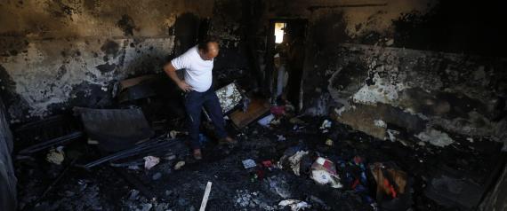 epa04867168 A Palestinian man checks the fire damage to a relative's house in the  West Bank village of Douma near Nablus City, 31 July 2015. A Palestinian infant was killed and several people injured when their home was set alight in the northern West Bank early 31 July 2015, an official said. A group of masked people believed to be Israeli settlers threw flammable bombs into two houses on the outskirts of the village of Doma, south of Nablus, said Ghassan Daghlas, a Palestinian Authority official.  EPA/ALAA BADARNEH