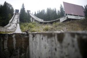 A view of the disused ski jump from the Sarajevo 1984 Winter Olympics on Mount Igman, near Sarajevo September 19, 2013. Abandoned and left to crumble into oblivion, most of the 1984 Winter Olympic venues in Bosnia's capital Sarajevo have been reduced to rubble by neglect as much as the 1990s conflict that tore apart the former Yugoslavia. The bobsleigh and luge track at Mount Trebevic, the Mount Igman ski jumping course and accompanying objects are now decomposing into obscurity. The bobsleigh and luge track, which was also used for World Cup competitions after the Olympics, became a Bosnian-Serb artillery stronghold during the war and is nowadays a target of frequent vandalism. The clock is now ticking towards the 2014 Winter Olympics, with October 29 marking 100 days to the opening of the Games in the Russian city of Sochi. Picture taken on September 19, 2013. REUTERS/Dado Ruvic (BOSNIA AND HERZEGOVINA - Tags: SOCIETY SPORT OLYMPICS SKIING)